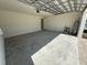 Spacious garage with concrete floor and access door at 2007 Iorio St, Saint Cloud, FL 34771