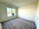 Bright bedroom with carpeted floor and large window at 2007 Iorio St, Saint Cloud, FL 34771