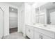 Elegant bathroom with double vanity and walk-in shower at 28054 Poppy Ct, Leesburg, FL 34748