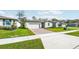 New home community with multiple houses, landscaping, and sidewalks at 28054 Poppy Ct, Leesburg, FL 34748