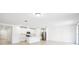 Modern kitchen with white cabinets, stainless steel appliances, and an island at 28054 Poppy Ct, Leesburg, FL 34748