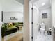 Modern bathroom with unique tile flooring and a view of the living room at 3701 Wyldwoode Ln, Orlando, FL 32806