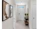 Light and airy entryway with a console table and stylish decor at 3863 Rory Pond Ct, Lakeland, FL 33811