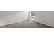 Bedroom with gray carpet and a window, offering natural light at 3863 Rory Pond Ct, Lakeland, FL 33811
