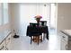 Bright kitchen nook featuring a table, chairs, and access to sliding glass doors at 4420 Heritage Trl, Leesburg, FL 34748