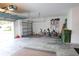Two-car garage with overhead storage and ample space for bikes and equipment at 4420 Heritage Trl, Leesburg, FL 34748