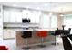 Spacious kitchen with granite counters, island, and stainless steel appliances at 4420 Heritage Trl, Leesburg, FL 34748