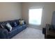 Relaxing living room with a comfy couch and natural light at 4420 Heritage Trl, Leesburg, FL 34748