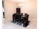 Formal dining room with a six-chair table and a chandelier at 4420 Heritage Trl, Leesburg, FL 34748