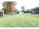 Landscaped community with tree-lined streets and homes at 4420 Heritage Trl, Leesburg, FL 34748