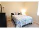 Cozy bedroom with a queen-size bed, nightstands, and dresser at 4420 Heritage Trl, Leesburg, FL 34748