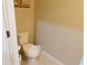 Small bathroom with toilet and updated flooring at 4420 Heritage Trl, Leesburg, FL 34748
