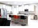 Spacious kitchen with granite counters, island, and stainless steel appliances at 4420 Heritage Trl, Leesburg, FL 34748