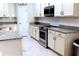Spacious kitchen with granite counters and stainless steel appliances at 4420 Heritage Trl, Leesburg, FL 34748