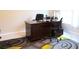 Spacious home office features a large desk, comfortable chairs, and ample natural light at 4420 Heritage Trl, Leesburg, FL 34748