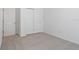 Simple bedroom with gray carpet and white walls at 4706 Jasmine Cir, Leesburg, FL 34748