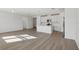 Modern kitchen with white cabinets, an island, and stainless steel appliances at 4706 Jasmine Cir, Leesburg, FL 34748