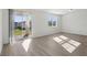 Bright living room with sliding glass doors leading to the backyard at 4706 Jasmine Cir, Leesburg, FL 34748