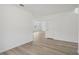 Clean hallway with light wood flooring leading to living areas at 4710 Jasmine Ct, Leesburg, FL 34748