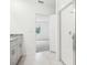 Bathroom with grey tile floor, granite vanity and bedroom access at 4736 Jasmine Cir, Leesburg, FL 34748