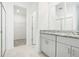 Bathroom boasts granite countertop, double vanity, and walk-in closet at 4736 Jasmine Cir, Leesburg, FL 34748