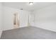 Bedroom with grey carpet, double closet and bathroom access at 4736 Jasmine Cir, Leesburg, FL 34748