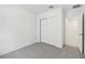 Bedroom with grey carpet, double closet and access to bathroom at 4736 Jasmine Cir, Leesburg, FL 34748