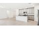 Modern kitchen with gray cabinets, granite countertops and stainless steel appliances at 4736 Jasmine Cir, Leesburg, FL 34748