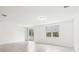 Bright and spacious living room with tile flooring and sliding glass doors at 4736 Jasmine Cir, Leesburg, FL 34748