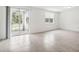 Spacious living area with tile floors and access to backyard patio at 4736 Jasmine Cir, Leesburg, FL 34748