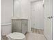 Simple bathroom with gray vanity and toilet at 4751 Jasmine Cir, Leesburg, FL 34748