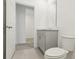 Simple bathroom with grey vanity and view of another room at 4751 Jasmine Cir, Leesburg, FL 34748