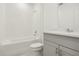 Clean bathroom featuring a bathtub, toilet and gray vanity at 4751 Jasmine Cir, Leesburg, FL 34748