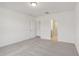 Bright bedroom with carpet and access to bathroom at 4751 Jasmine Cir, Leesburg, FL 34748