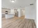Open kitchen with gray cabinets, stainless steel appliances, and an island at 4751 Jasmine Cir, Leesburg, FL 34748