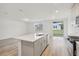 Bright kitchen with an island and view of backyard at 4751 Jasmine Cir, Leesburg, FL 34748