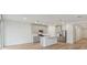 Modern kitchen with gray cabinets, a large island, and stainless steel appliances at 4751 Jasmine Cir, Leesburg, FL 34748