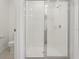 Clean shower with glass enclosure and white tiles at 4751 Jasmine Cir, Leesburg, FL 34748