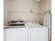 Laundry room with washer, dryer, and shelving at 4929 Dunmore Ln, Kissimmee, FL 34746