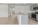 Kitchen island with granite countertop and stainless steel sink at 5100 Tana Ter, Saint Cloud, FL 34772