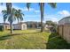 Spacious backyard with shed and grassy area at 724 Pincon Ln, Kissimmee, FL 34759