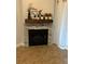 Modern corner fireplace with a wood mantel at 174 Waterfall Way # 106, Altamonte Springs, FL 32714