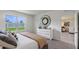 Bedroom with queen bed, dresser, and view of living room at 3827 Rory Pond Ct, Lakeland, FL 33811