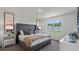 Main bedroom with plush bed, nightstands, and large window at 3827 Rory Pond Ct, Lakeland, FL 33811