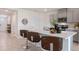 Modern kitchen island with seating and stainless steel appliances at 3827 Rory Pond Ct, Lakeland, FL 33811