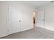 Bedroom with gray carpet and double door closets at 3827 Rory Pond Ct, Lakeland, FL 33811
