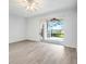 Bright bedroom with sliding doors to screened patio at 3984 Beacon Ridge Way, Clermont, FL 34711