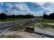 Aerial view of a new community entrance with roads and landscaping at 5312 Center Lake Ranch Blvd, St Cloud, FL 34771