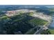 Aerial view of large undeveloped land with lakes and some existing homes in the distance at 5312 Center Lake Ranch Blvd, St Cloud, FL 34771