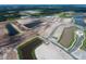 Aerial view of a large area of undeveloped land with lakes and some new construction at 5312 Center Lake Ranch Blvd, St Cloud, FL 34771